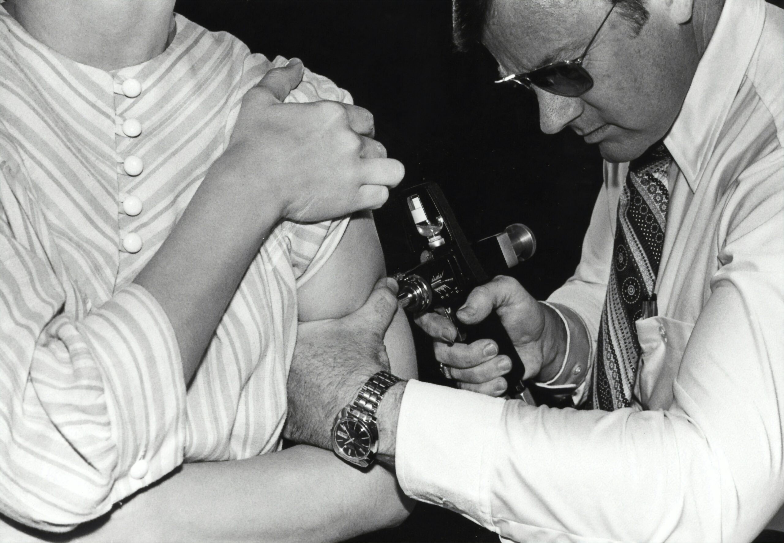 A bride applying moisturizer as part of her skincare routine