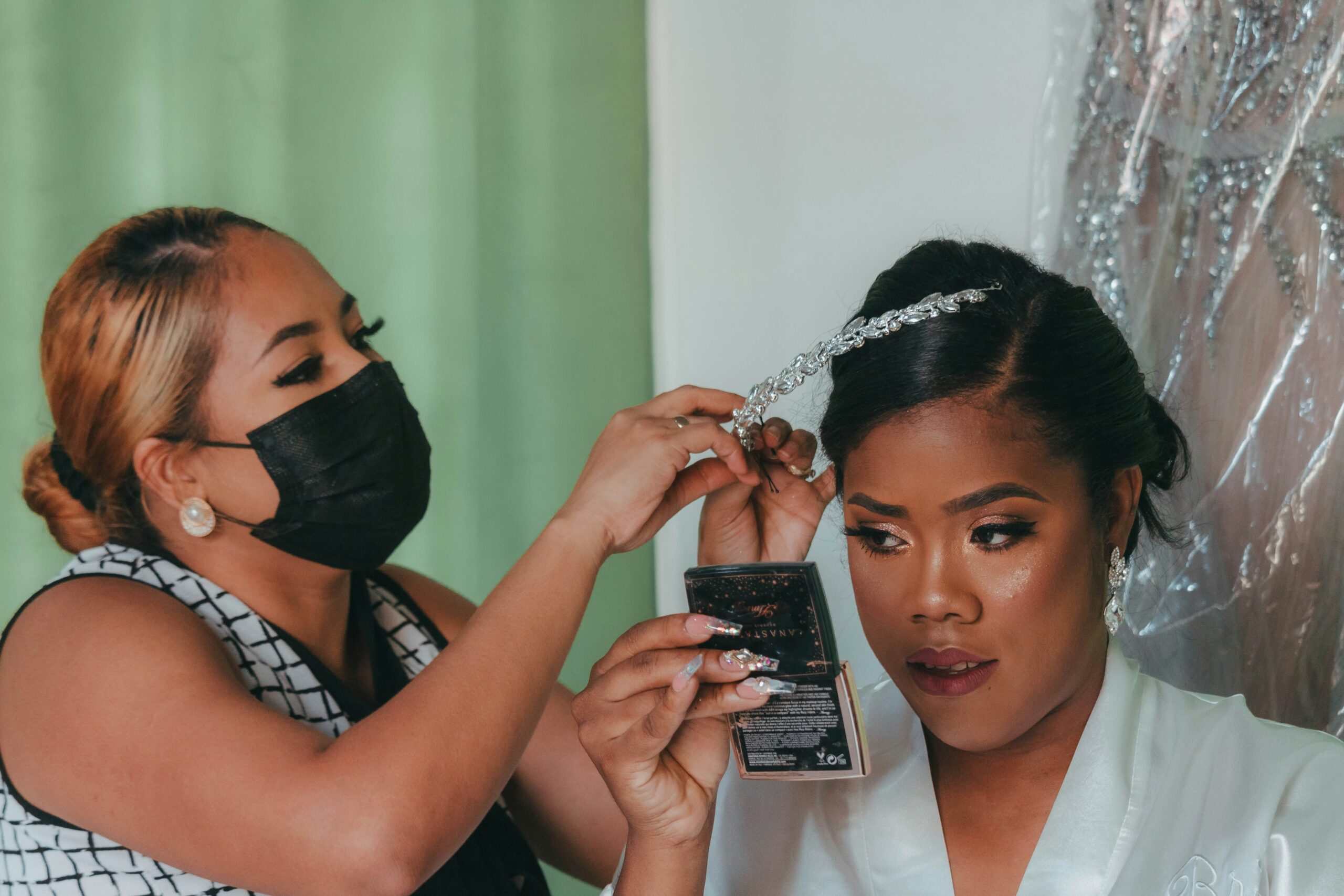 bridal makeup artist applying foundation