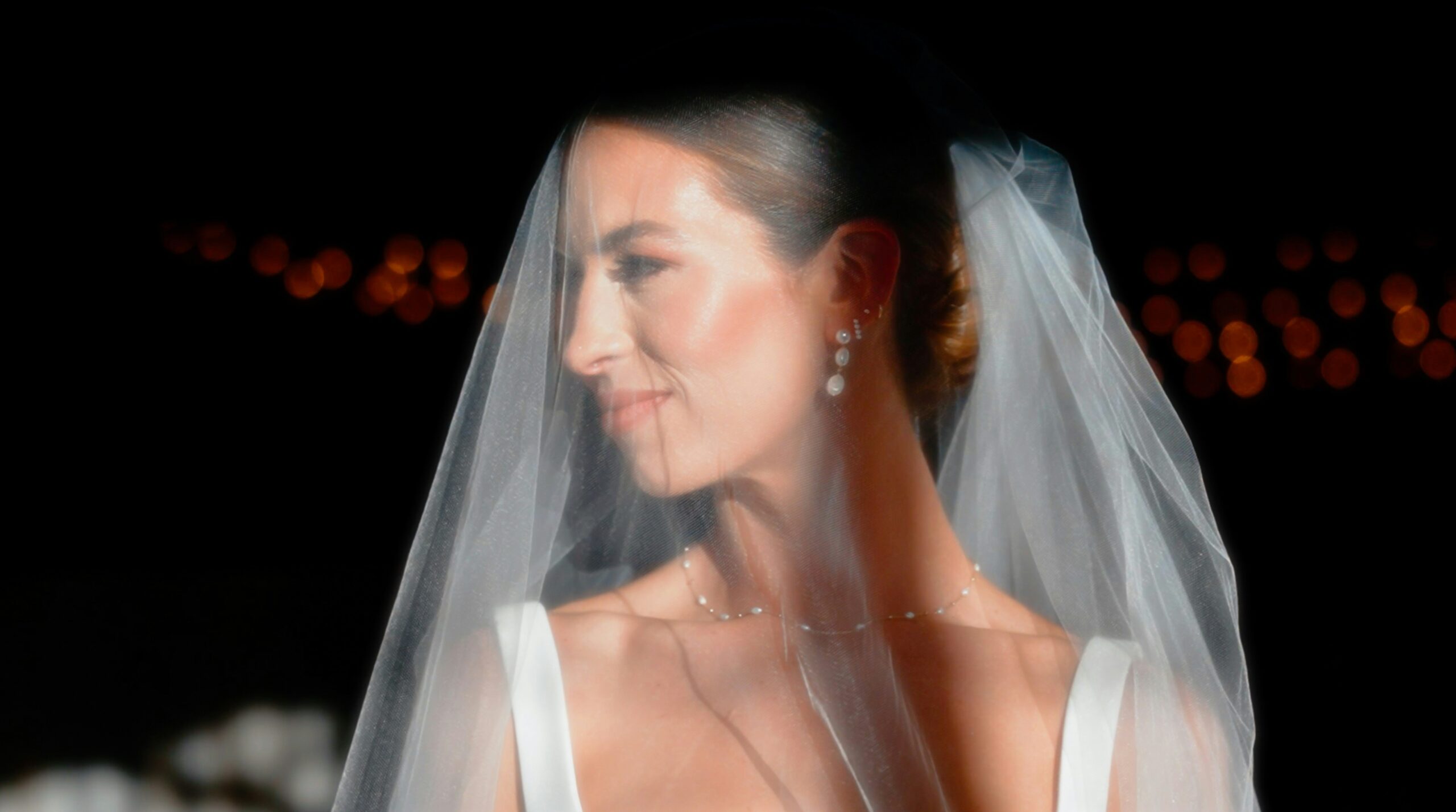 Bride wiping sweat off her face near altar