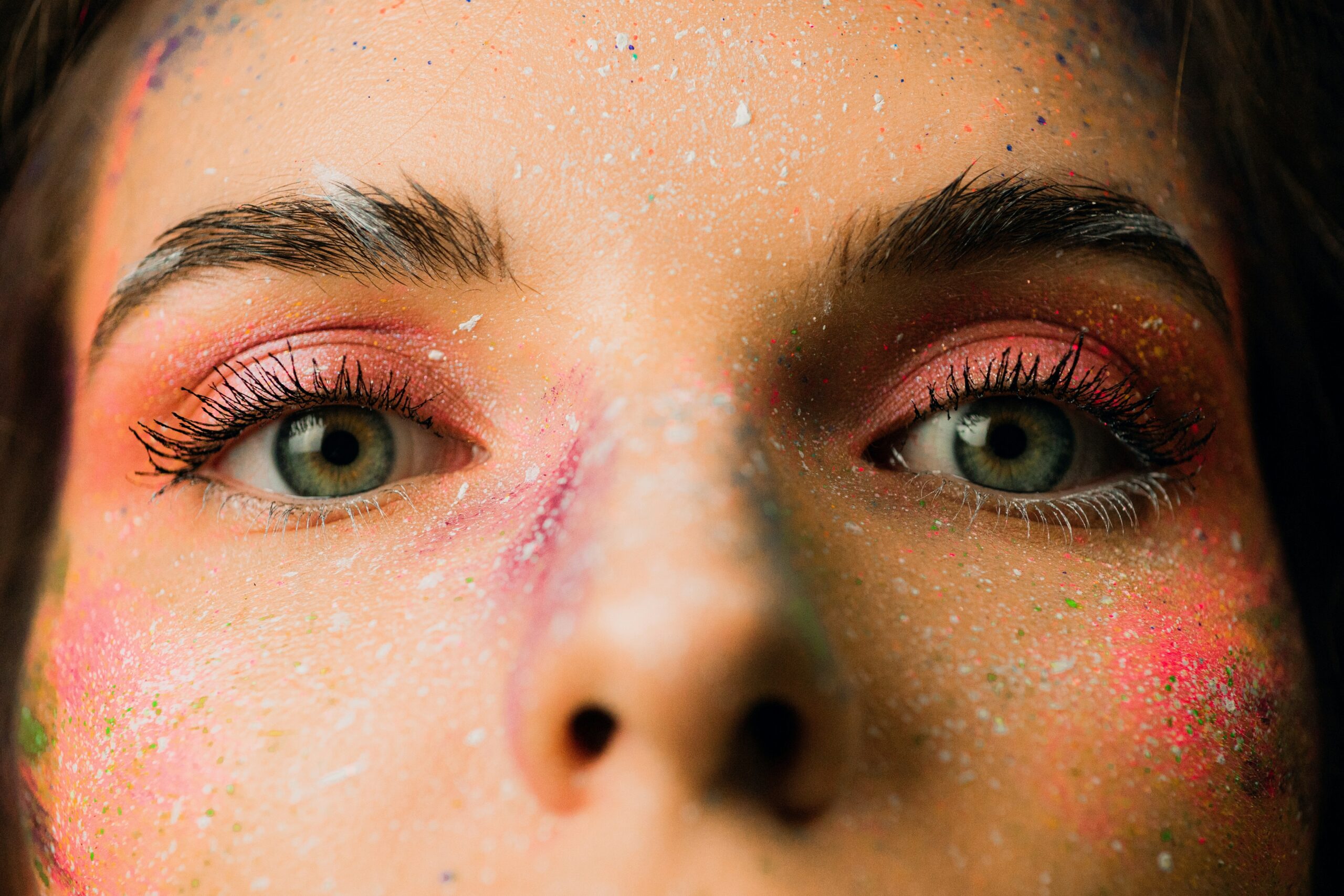 Close-up of a bride's face showing signs of makeup fading due to harsh lighting