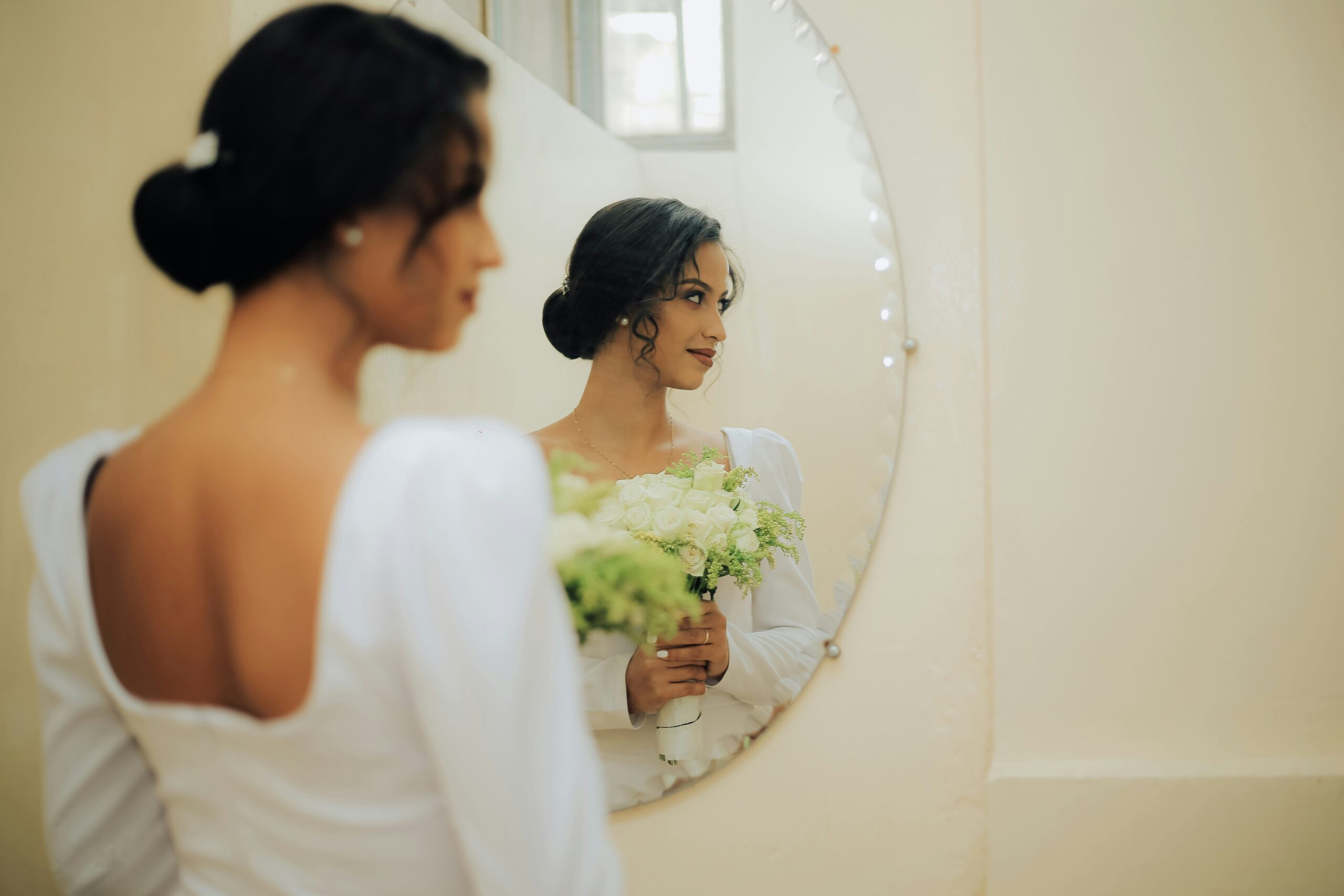 Side-by-side images comparing a bride's makeup-free face to her final bridal look