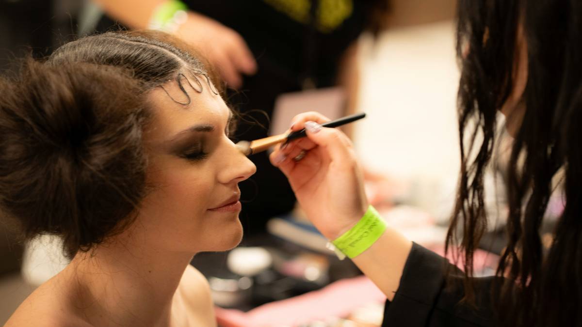 Bride wearing delicate blush tones with shimmer highlighter