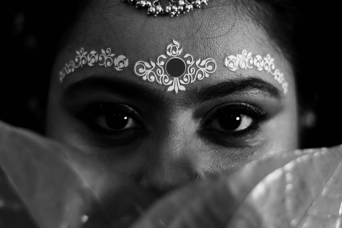 Close-up of hand-applied wedding false eyelashes
