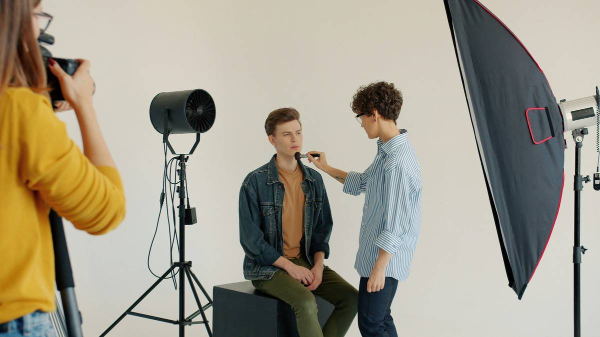 Professional bridal makeup artist applying blush