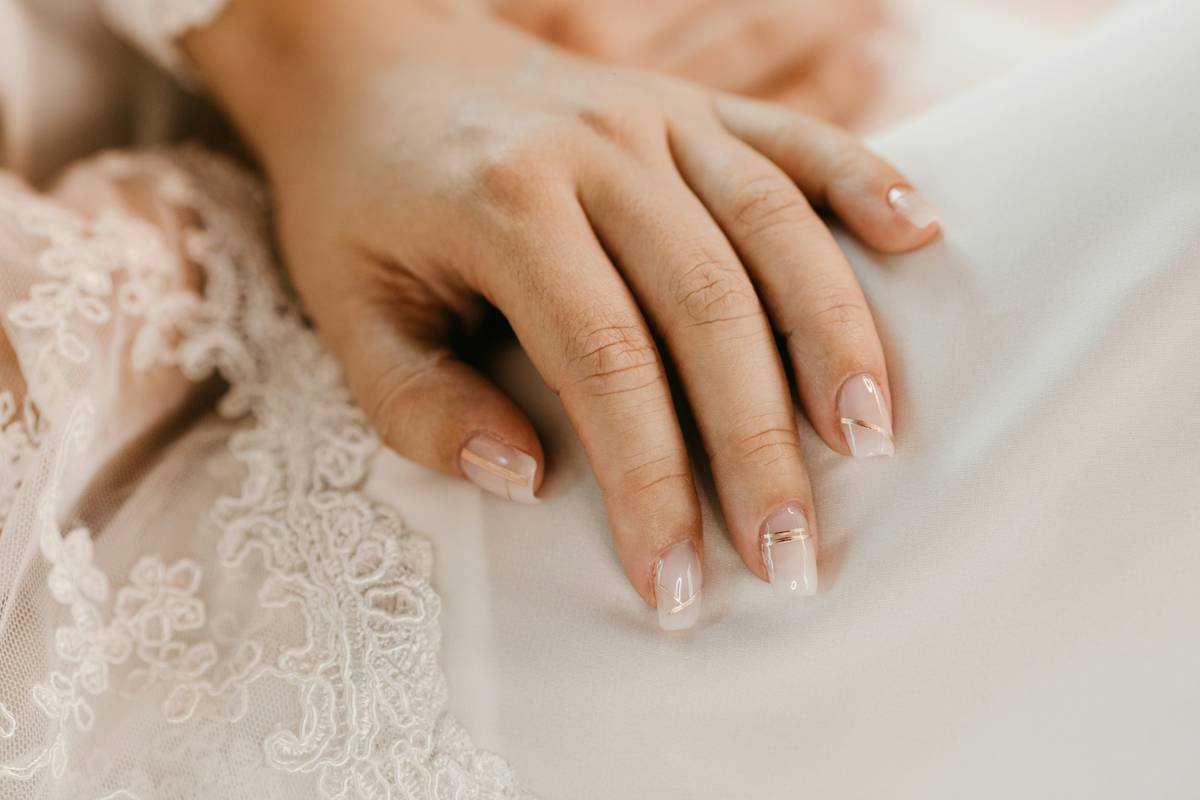 Close-up shot of a glowing bride smiling during her special day.
