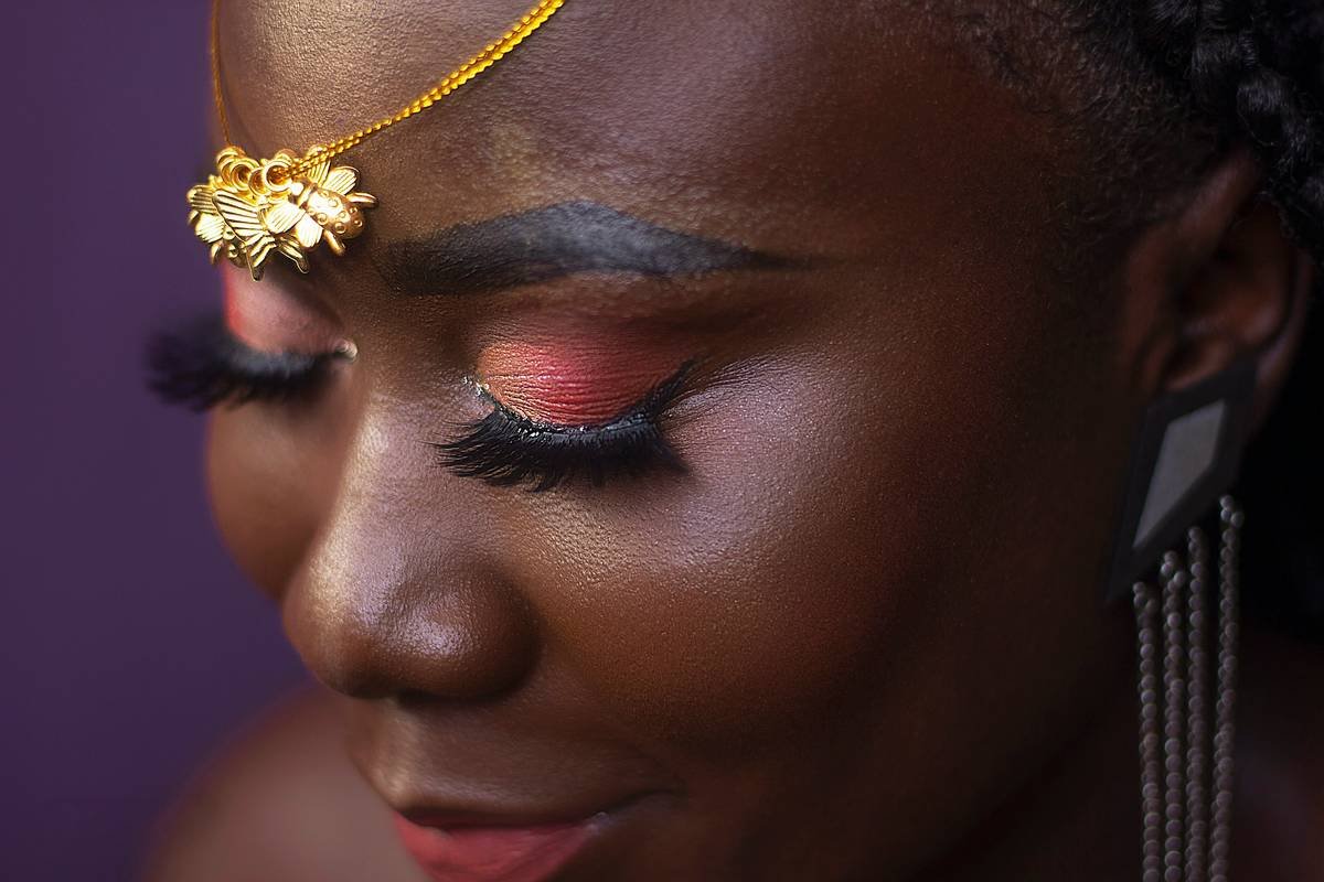 A close-up image of glamorous prom makeup featuring soft blush tones and shimmering eyeshadow.