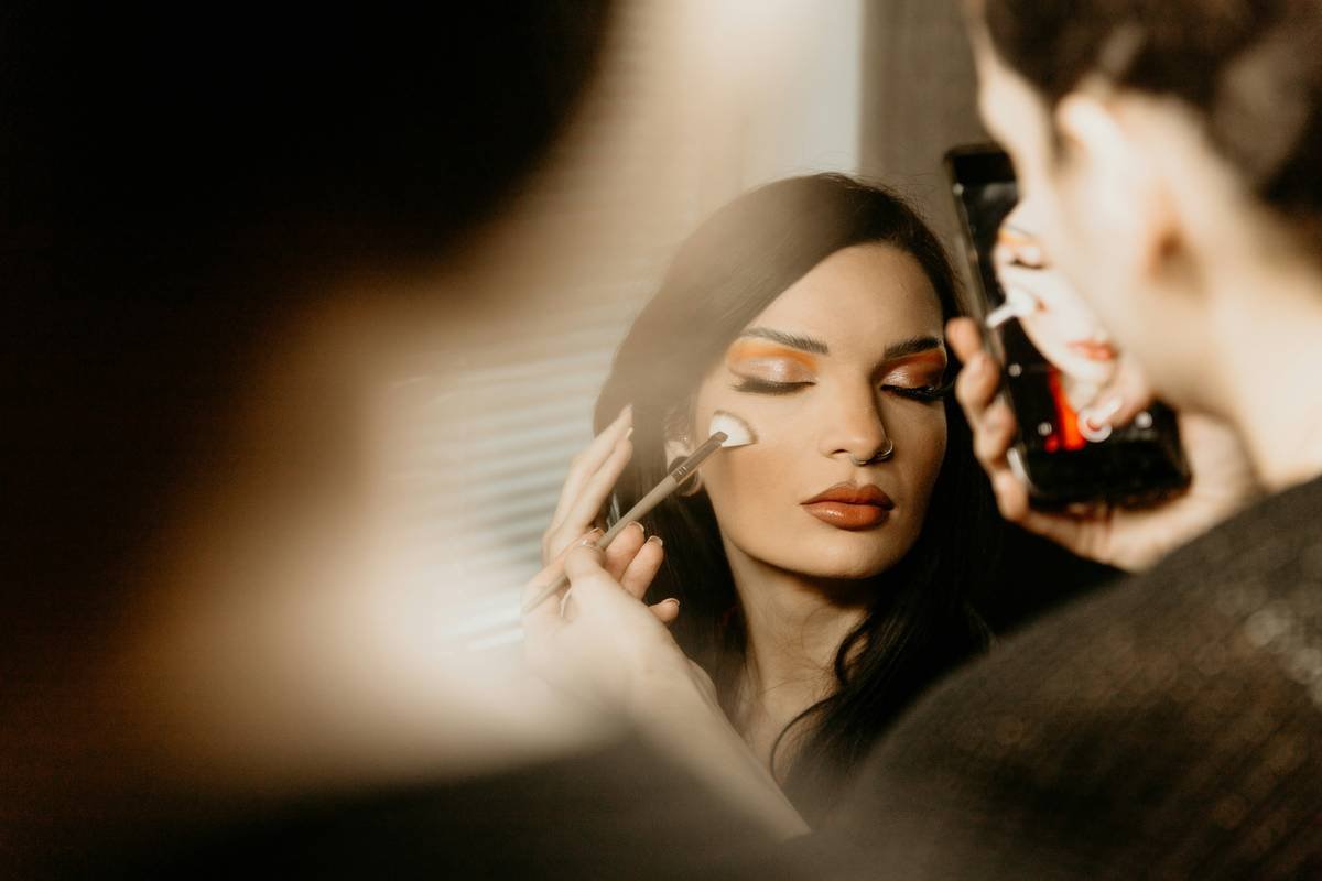 Elegant dinner party makeup look with soft bronze eyes and satin lips