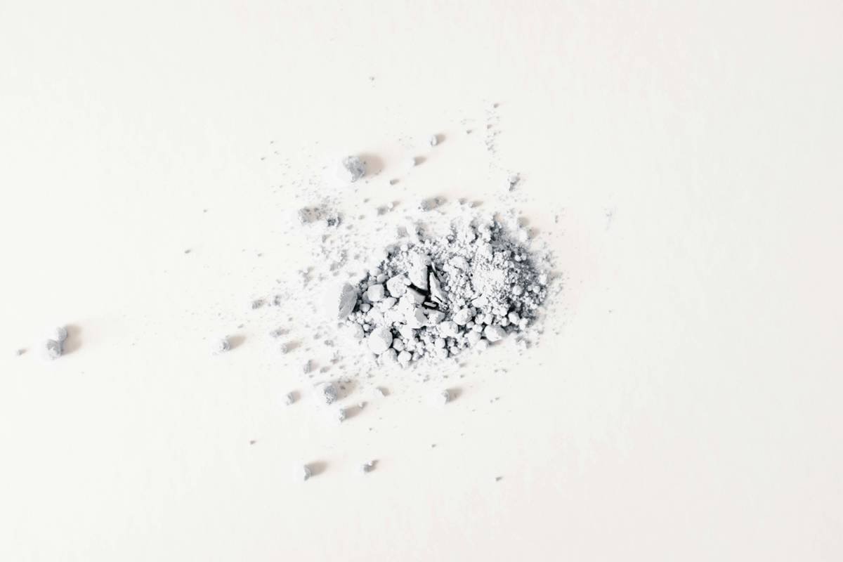 Bridal makeup artist applying foundation with pressing motion to make foundation last all day